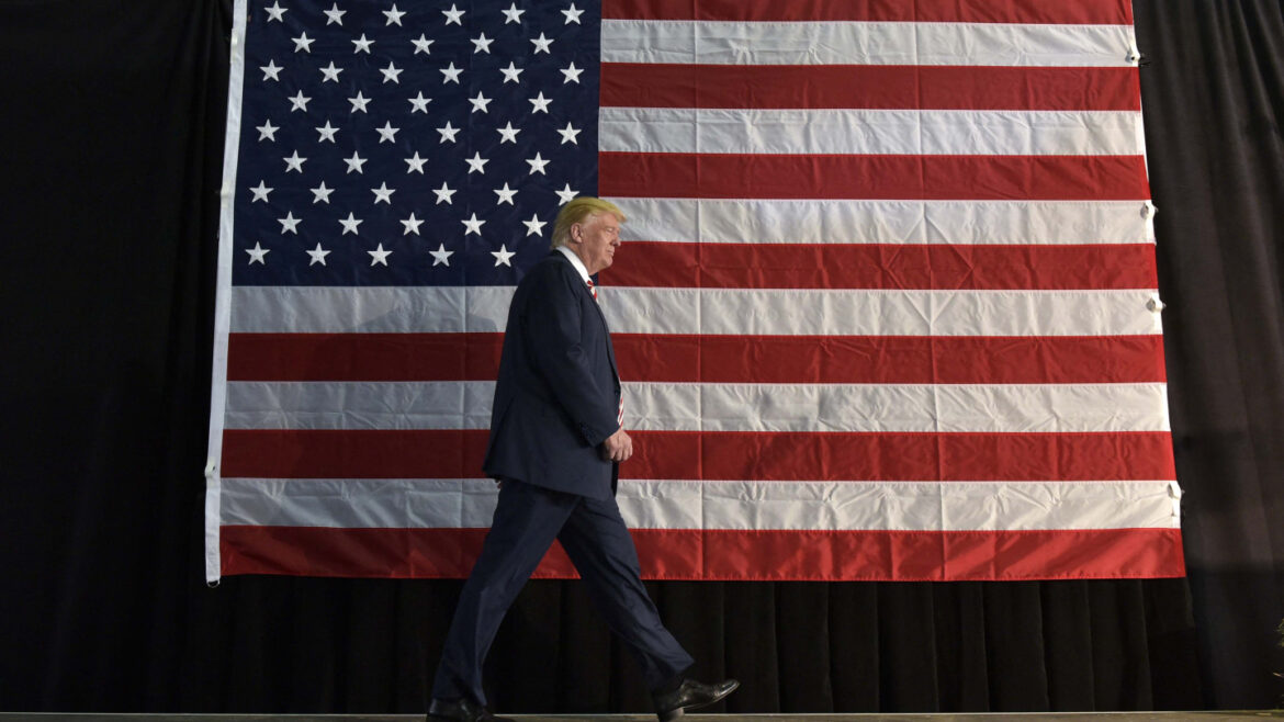 President Trump with the U.S. flag behind him